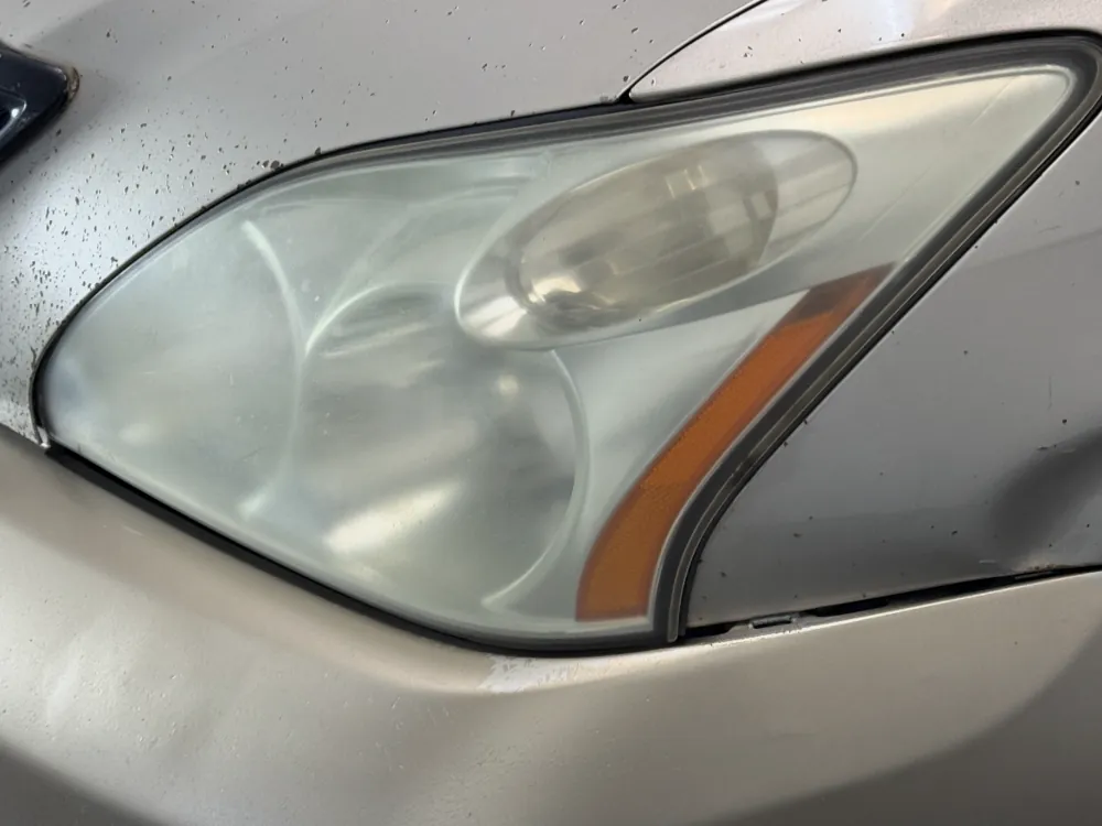 Hazy, oxidized headlight lens before restoration