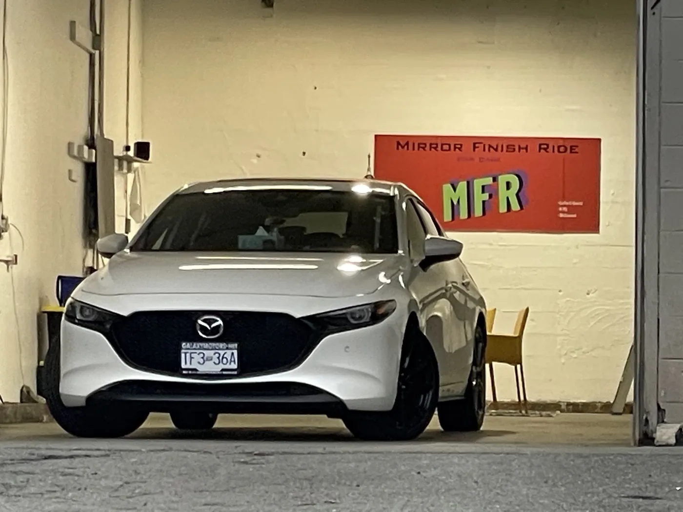 White Mazda in the Mirror Finish Ride shop under the MFR banner